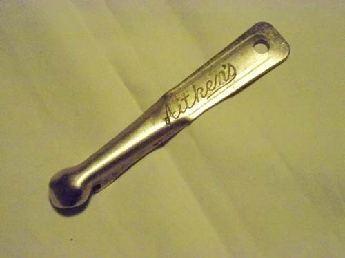 Bottle opener promoting James Aitken & Co (Falkirk) Ltd